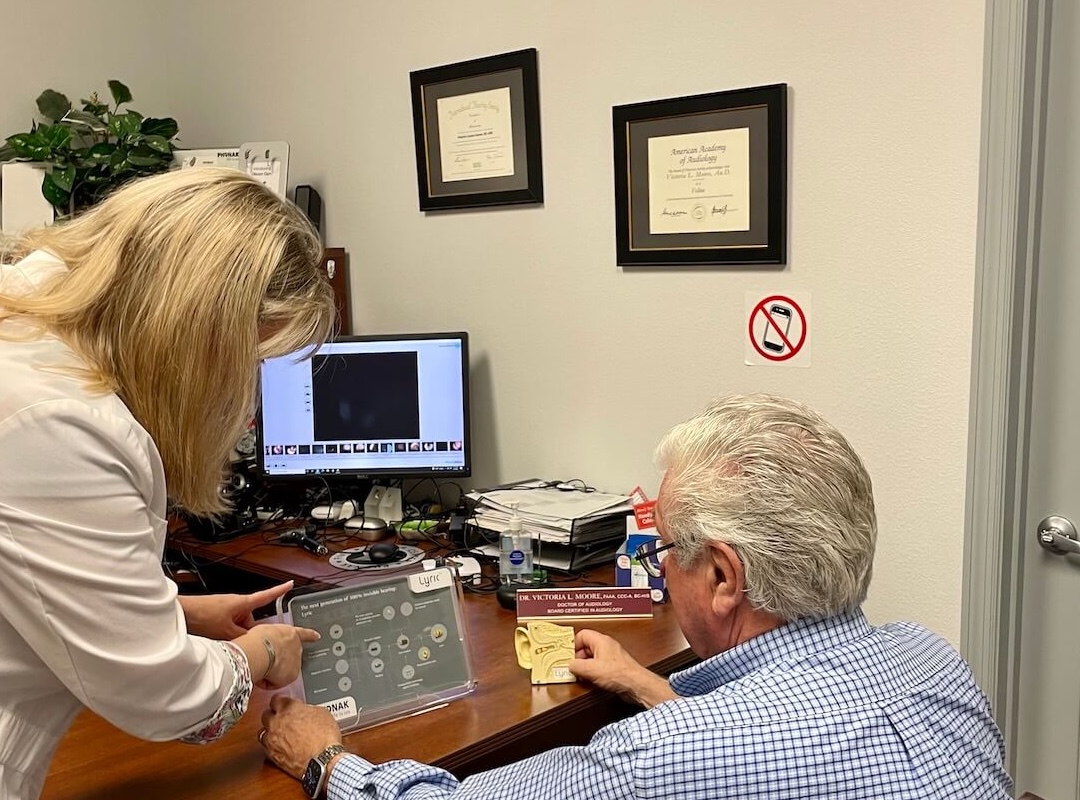 audiologist explaining results to a patient
